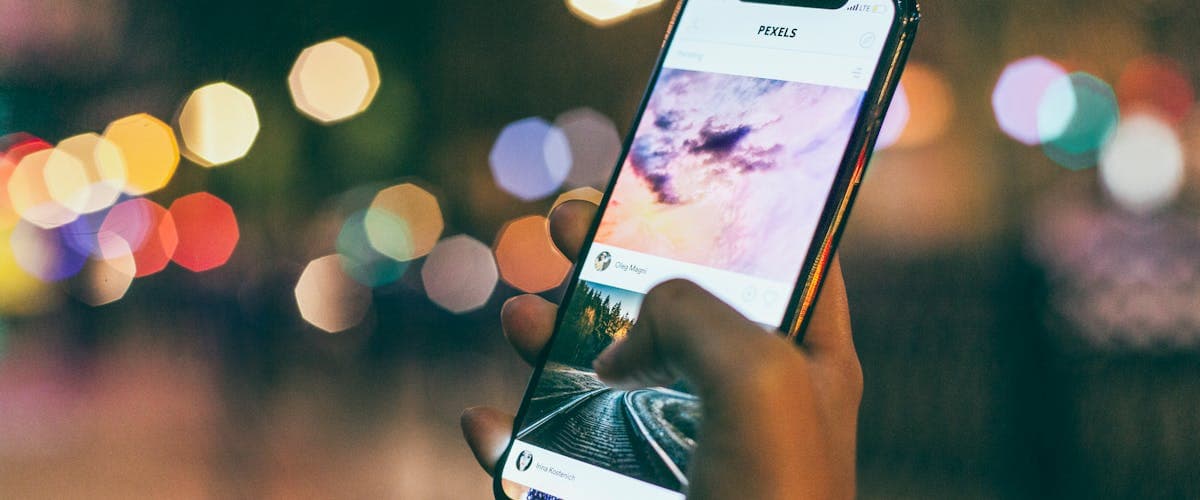 Phone showing an IPTV app with low-cost streaming plans